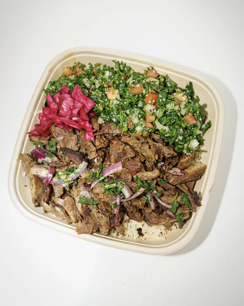 Beef shawarma with tabbouleh and pickled cabbage in a to-go bowl