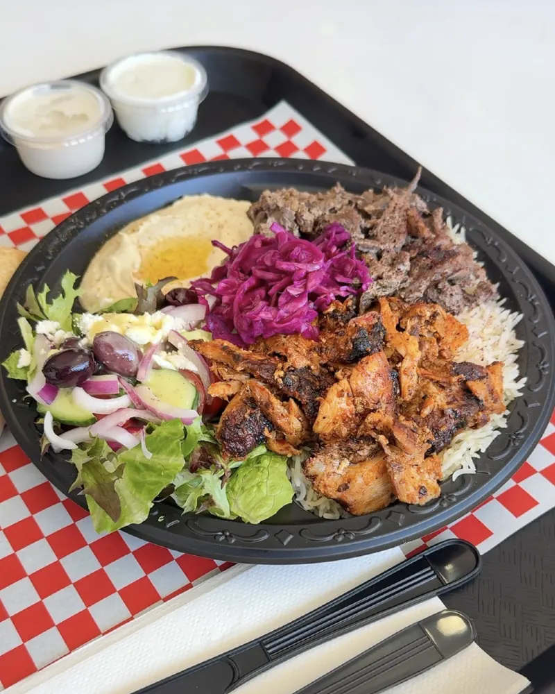 Mixed shawarma plate with rice, salad and hummus