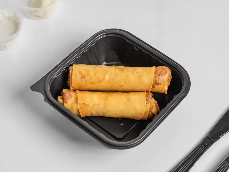 Two cheese sticks in a to-go box